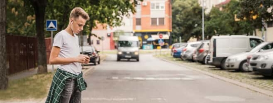 Teen crossing street with oncoming van